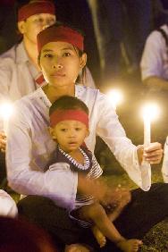 Supporters for democracy in Myanmar hold a candle light vigil in New Delhi Saturday.